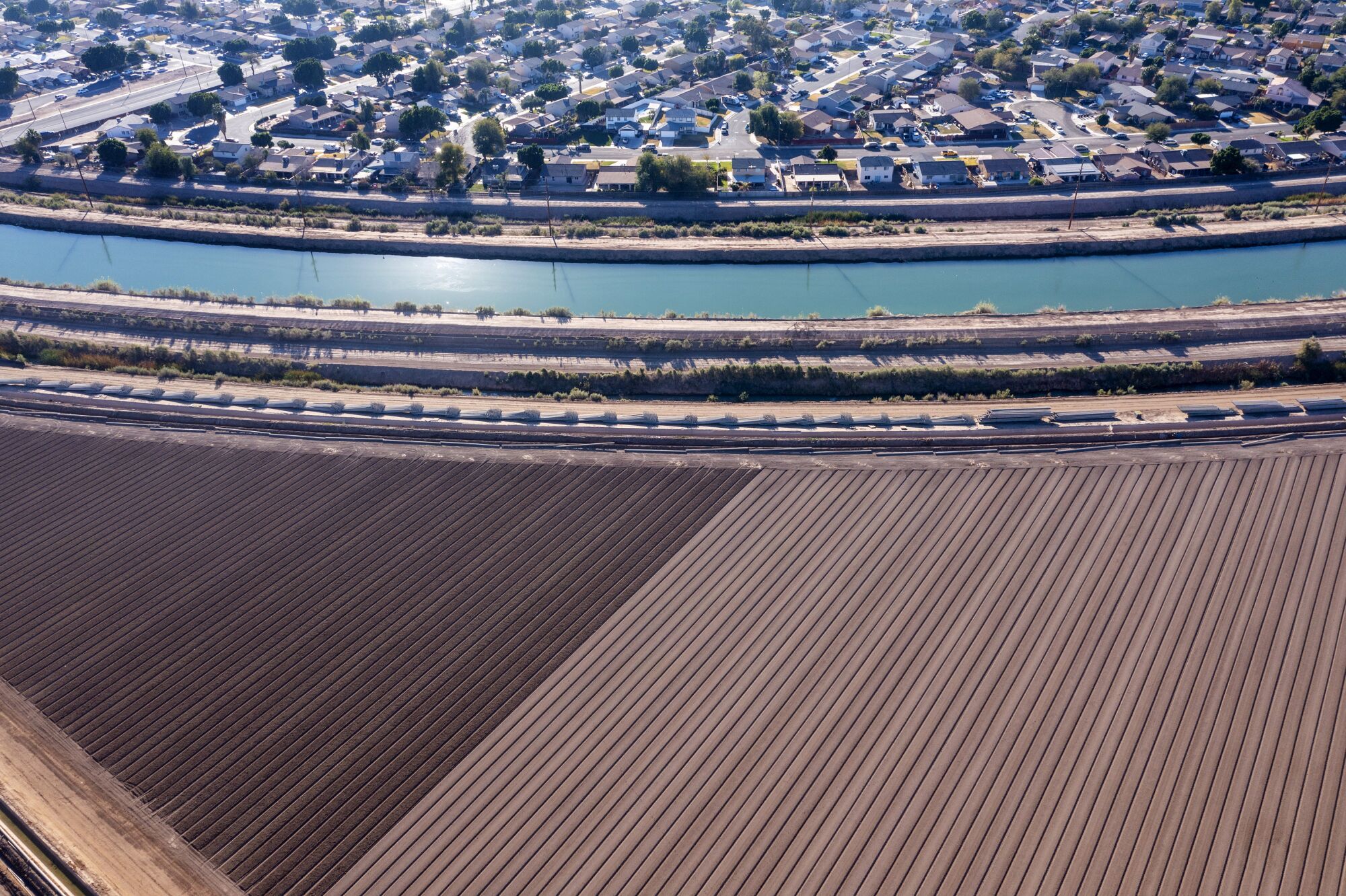 The All-American Canal in Calexico is where suburbia meets agriculture.