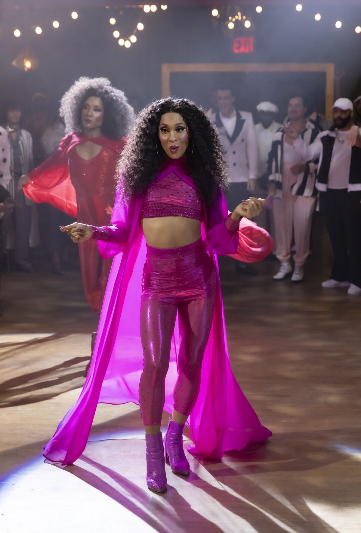 Mj Rodriguez in a bright pink outfit in a scene from "Pose."
