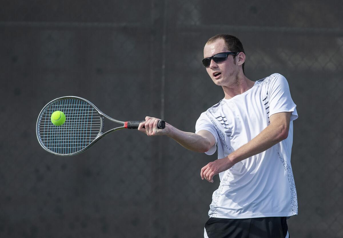 Estancia's Jamieson McLellan returns a forehand during a Battle for the Bell match at Costa Mesa High School on Tuesday.