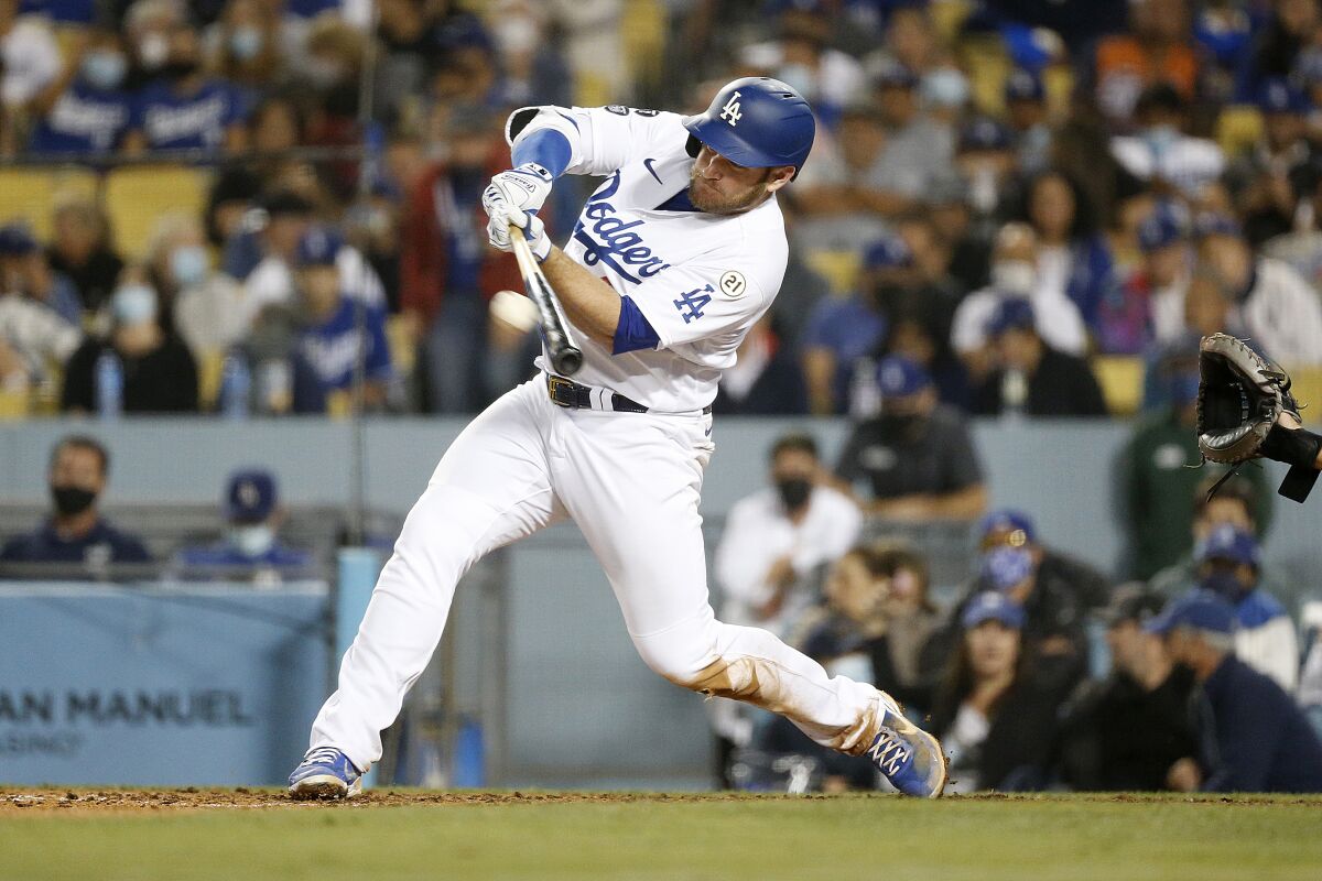 Dodgers first baseman Max Muncy hits a solo home run.