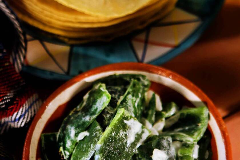 Rajas con crema is charred poblano pepper strips with cream.