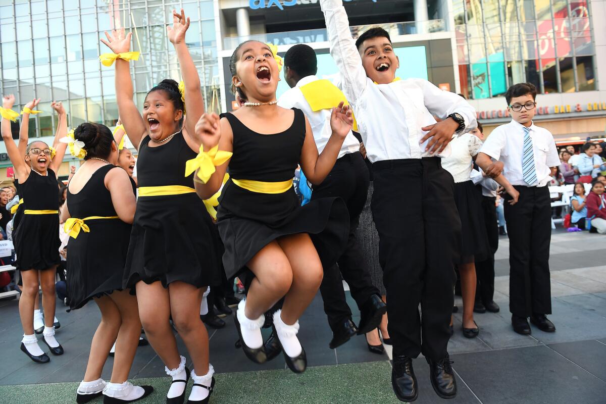 Estrella students are jubilant after winning the championship for the second straight year. Most of the fifth-graders had never danced when they began training in February.