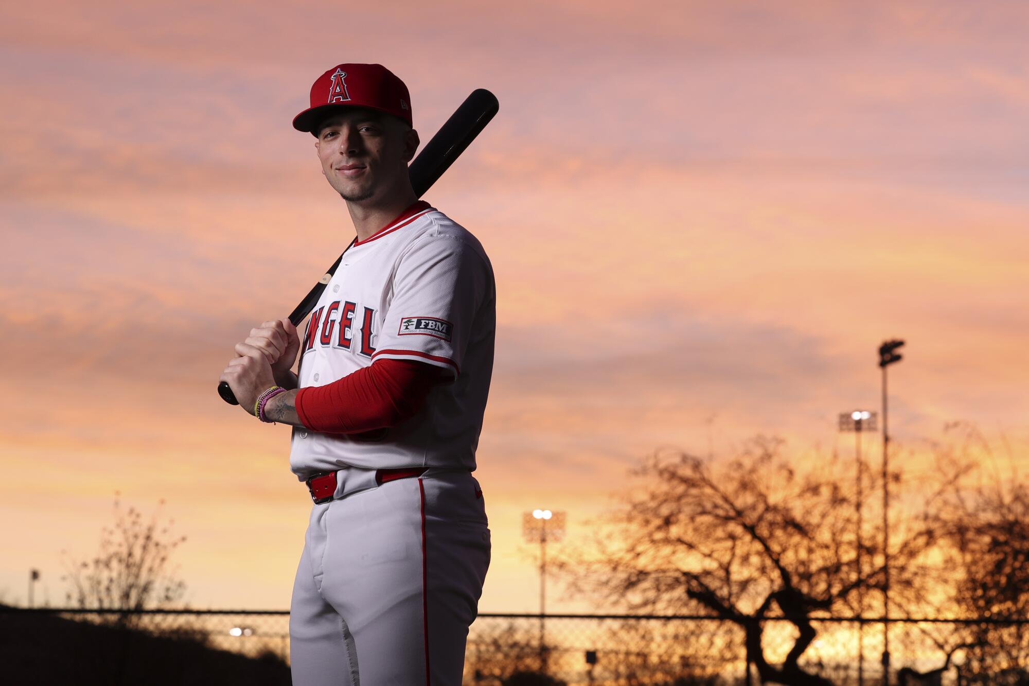 Zach Neto poses for a photo with a bat slug over his right shoulder during the Angels' photo day at spring training.