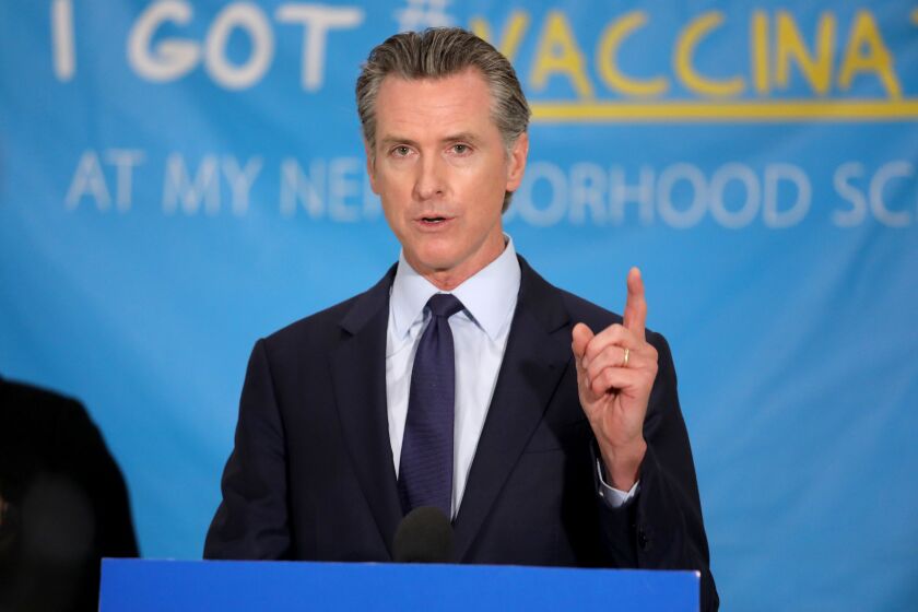LOS ANGELES, CA - MAY 27: Governor Gavin Newsom unveils a $116.5 million COVID-19 vaccine incentive plan, including cash prizes and gift cards at Esteban Torres High School, a COVID-19 vaccination site, on Thursday, May 27, 2021 in Los Angeles, CA. New efforts by the state to encourage more Californians - especially those in communities that have been hit hardest by the pandemic - to get vaccinated. (Gary Coronado / Los Angeles Times)