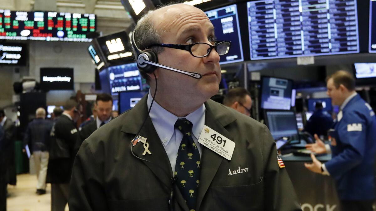 Trader Andrew Silverman works on the floor of the New York Stock Exchange.