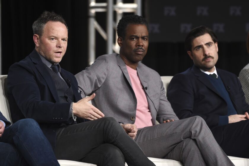 Noah Hawley, left, the creator/executive producer/writer/director of the FX series "Fargo," takes part in a panel discussion on the show alongside cast members Chris Rock, center, and Jason Schwartzman at the 2020 FX Networks Television Critics Association Winter Press Tour, Thursday, Jan. 9, 2020, in Pasadena, Calif. (AP Photo/Chris Pizzello)