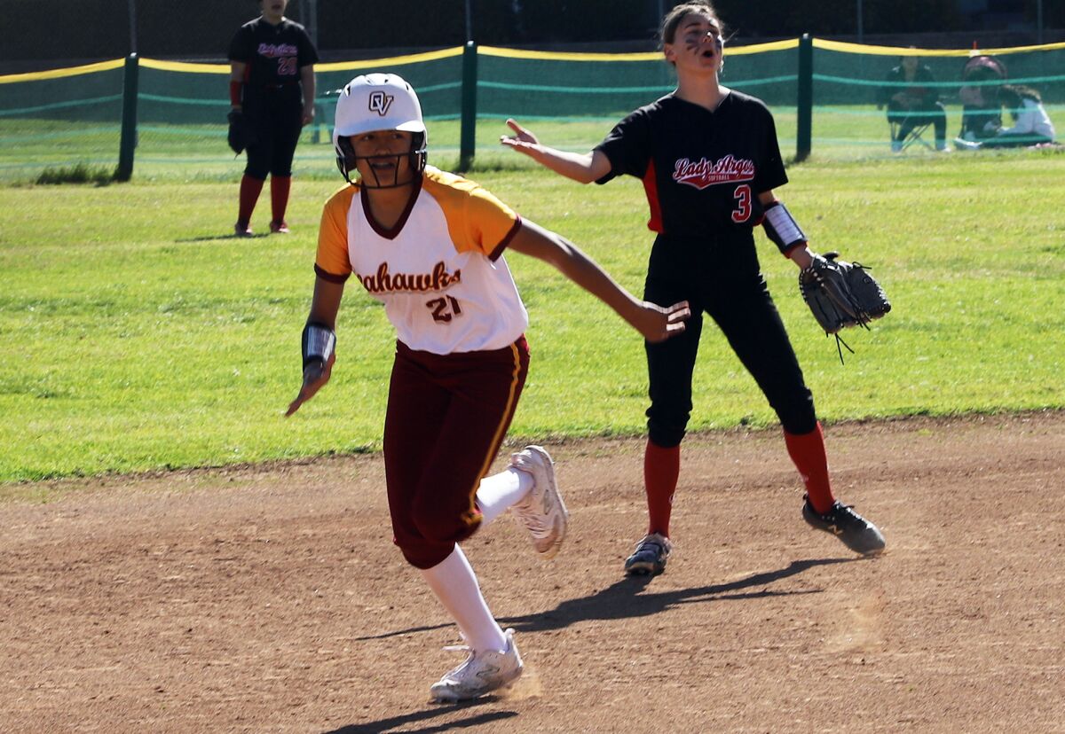Ocean View's Emily Mayorga (21) runs to third base in a Golden West League game against Garden Grove on Friday.