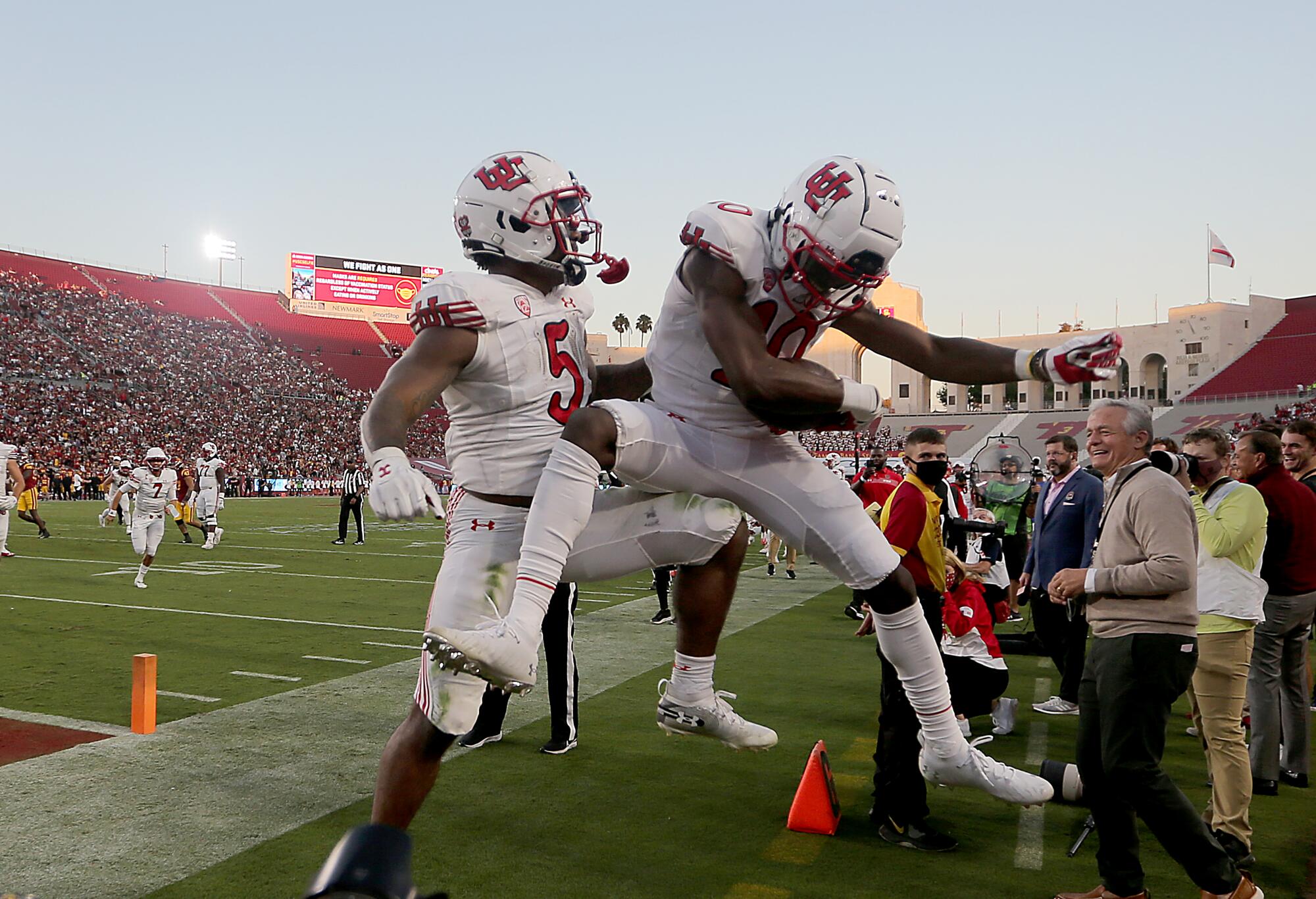 Utah receiver Money Parks celebrates after scoring a touchdown against USC in the first half.