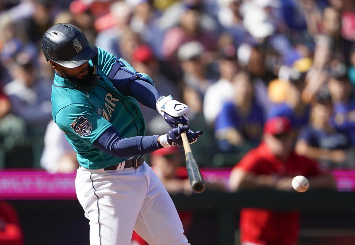 Julio Rodríguez scores the game-winning run after being walked as Mariners  beat Angels 3-2 - The San Diego Union-Tribune