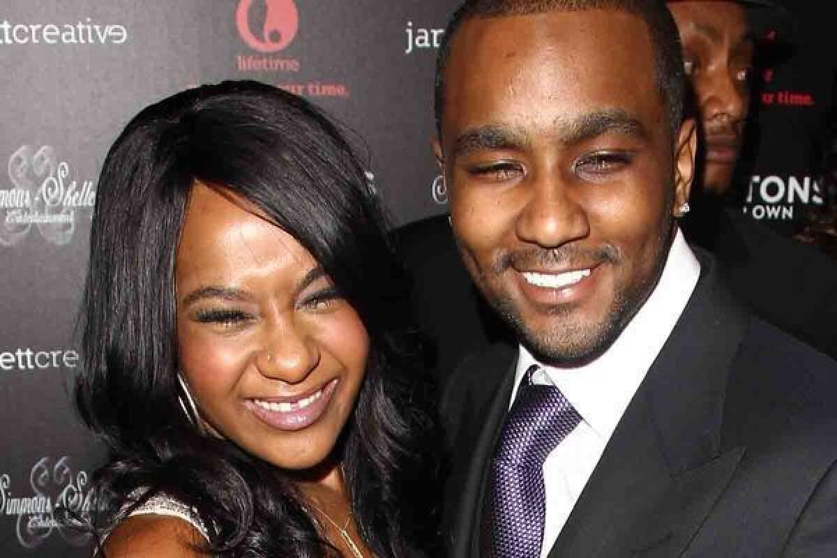 Bobbi Kristina Brown, shown with "adopted brother" Nick Gordon at the premiere of "The Houstons On Our Own," wrecked her Chevy Camaro near her Alpharetta, Ga., apartment complex Wednesday.