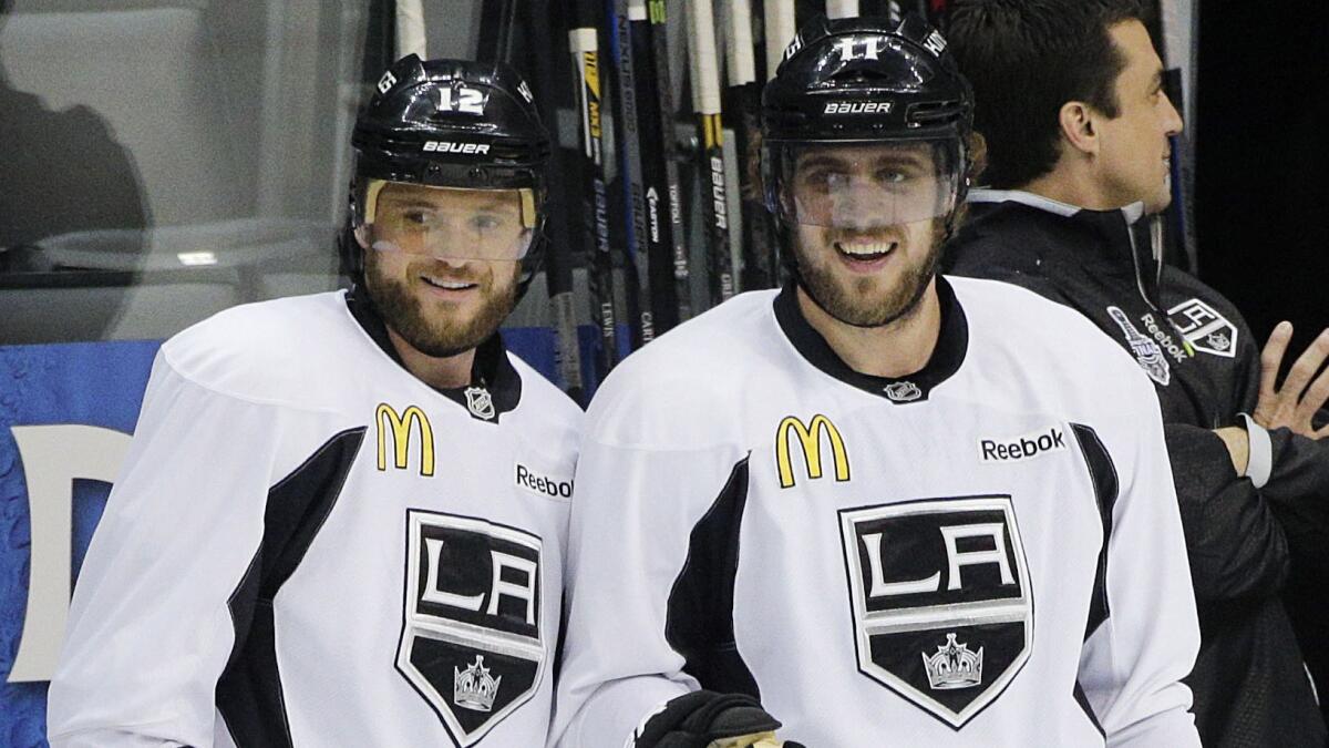 Kings teammates Marian Gaborik, left, and Anze Kopitar smile during a team practice session Tuesday. The Kings remain confident heading into Game 1 of the Stanley Cup Final against the New York Rangers.