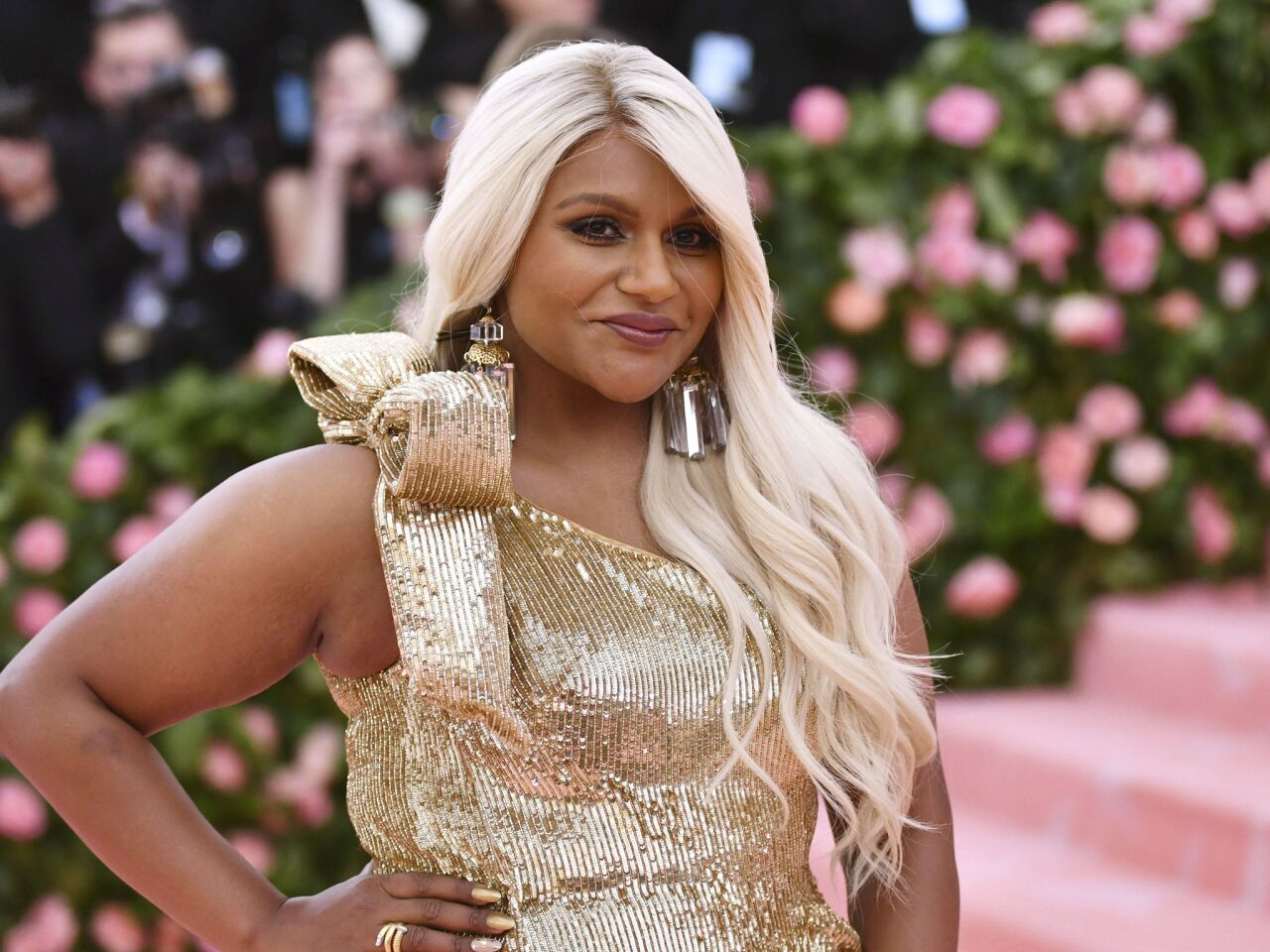 Mindy Kaling goes platinum blond for the Costume Institute benefit.