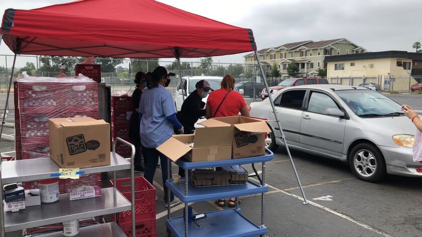 Free meals are distributed via drive-thru at Mission Middle School in the Escondido Union School District, which recently received a grant from the San Diego Foundation.