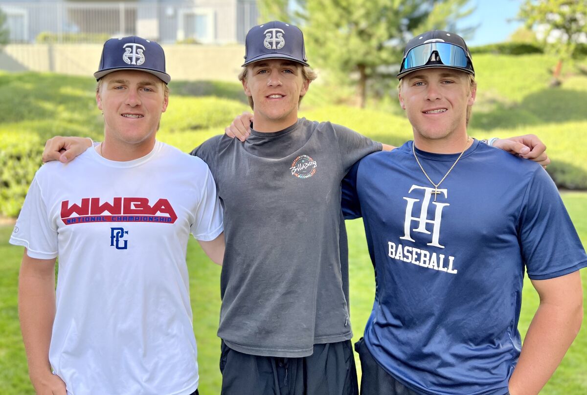 The Gray brothers, from left, Joey, Mikey and Bobby pose for a photo. Joey and Bobby are twins.