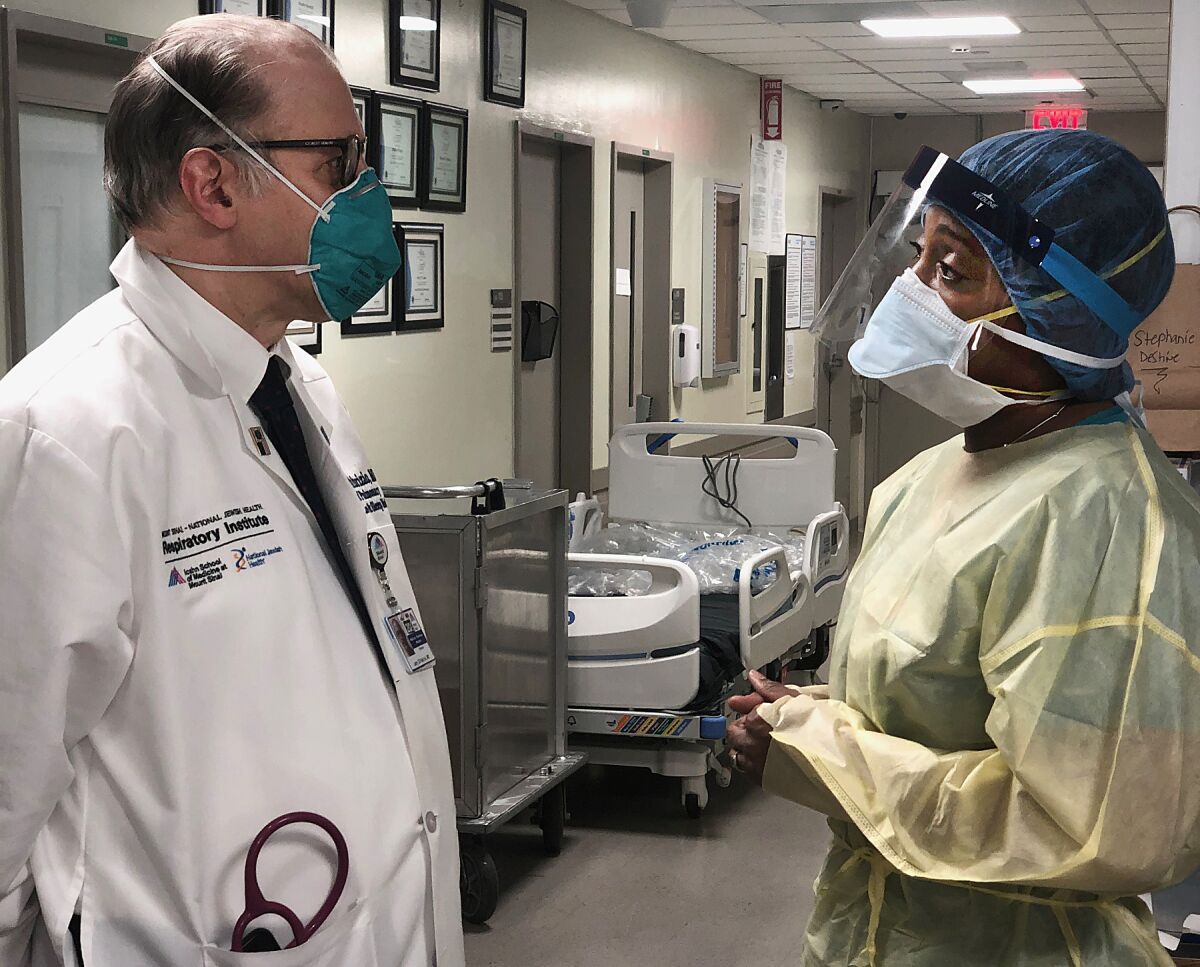 Dr. Larry Di Fabrizio and registered nurse Camille Davis at Mount Sinai Hospital.