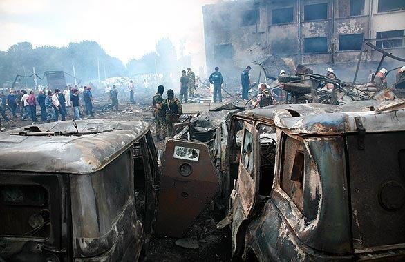 The burned shells of cars rest amid piles of rubble where a suicide bomber blew up a truckload of explosives at a police station in Nazran in the Russian republic of Ingushetia. The bomber struck as the workday got underway.