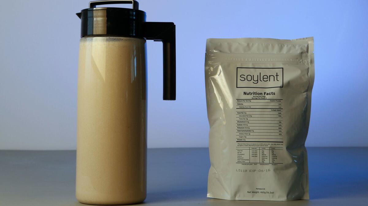 A pitcher of Soylent and the package the powder comes in. (Anne Cusack / Los Angeles Times)