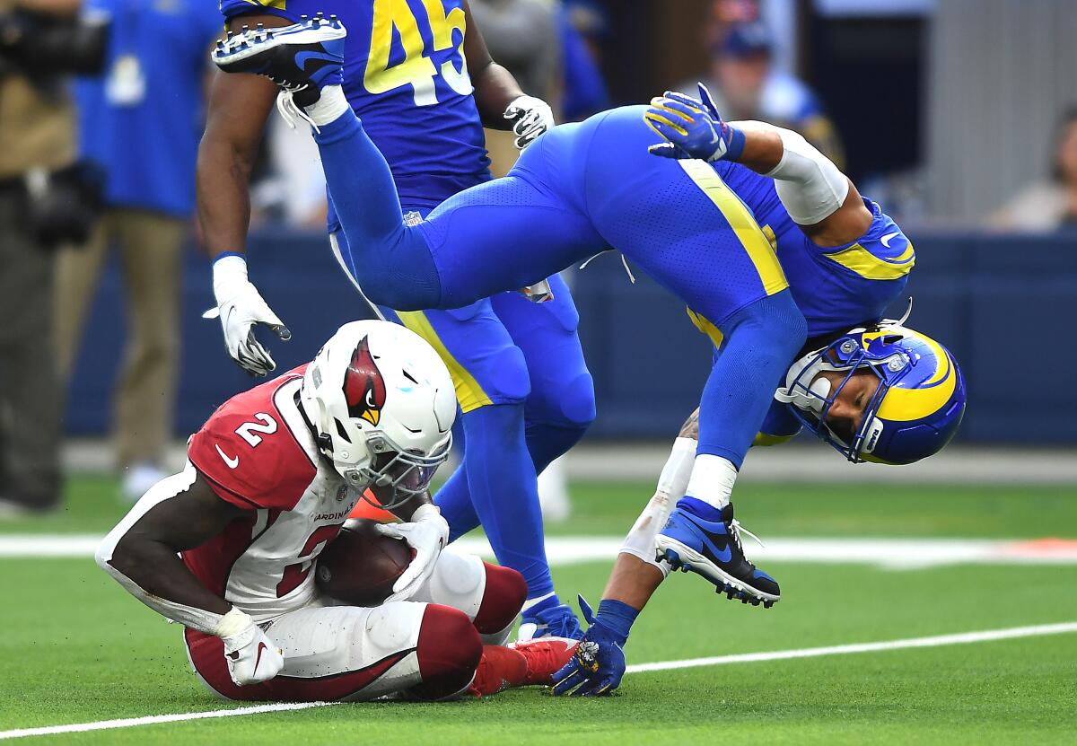  Cardinals running back Chase Edmonds picks up a first down  ahead of pursuit by Rams safety Taylor Rapp.
