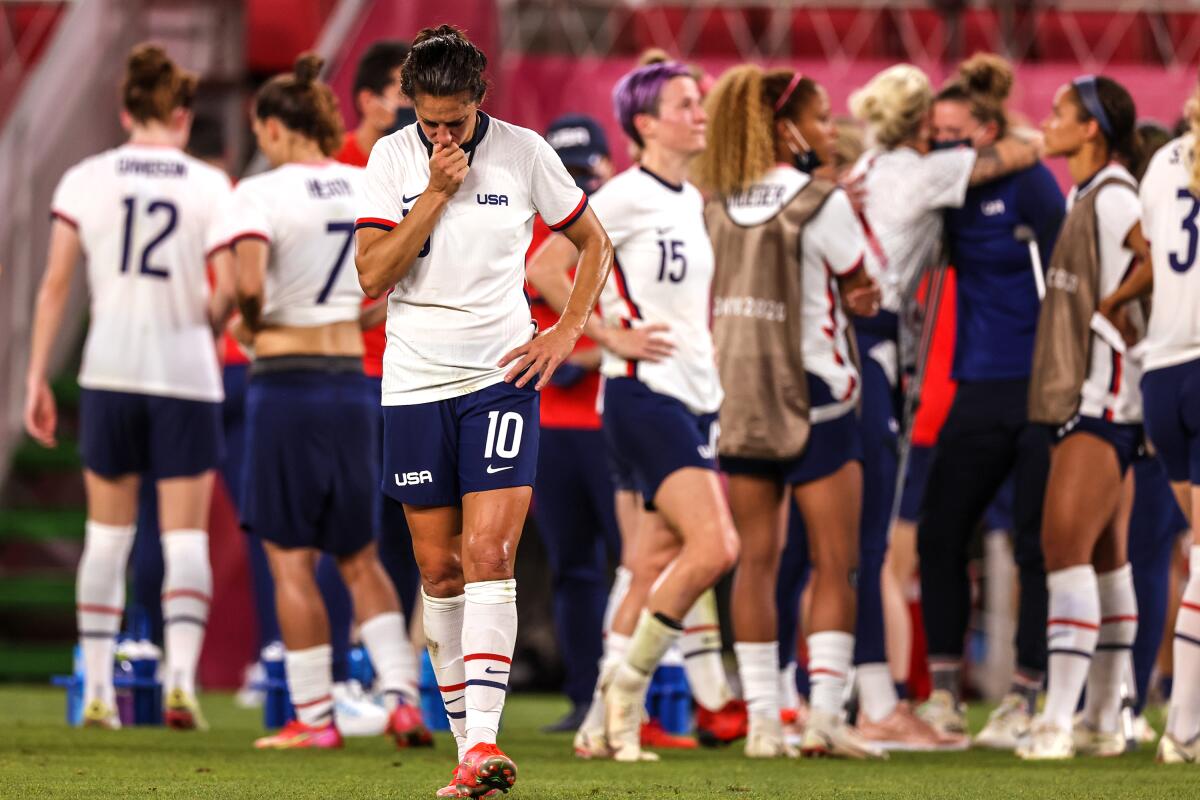 U.S. forward Carli Lloyd walks on the field after the team's semifinal loss to Canada at the Tokyo Olympics.