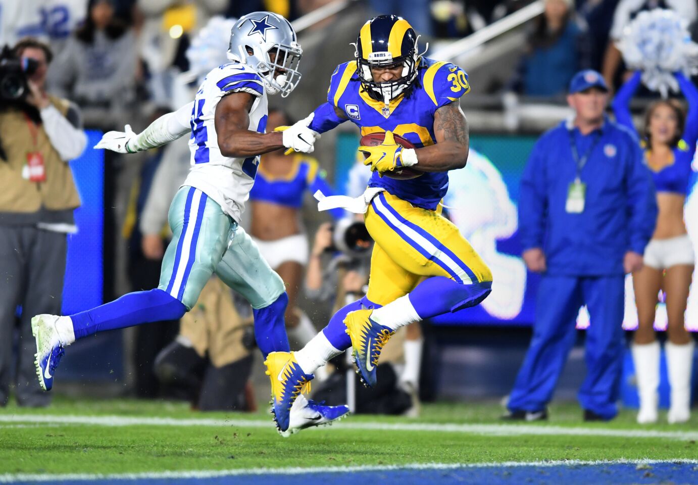 Rams running back Todd Gurley beats Cowboys cornerback Chidobe Awuzie to the goal line on a 35-yard touchdown run during the second quarter.