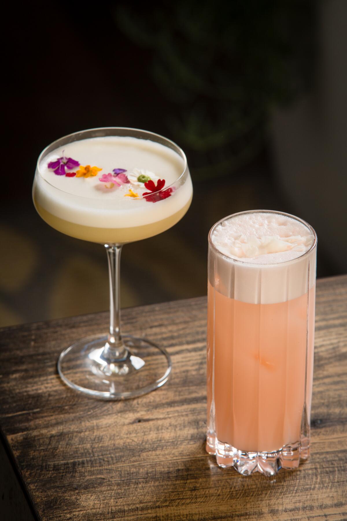 A Laurel cocktail infused with pineapple and a Fizzy Lizzy, a mezcal take on a Ramos Gin Fizz.