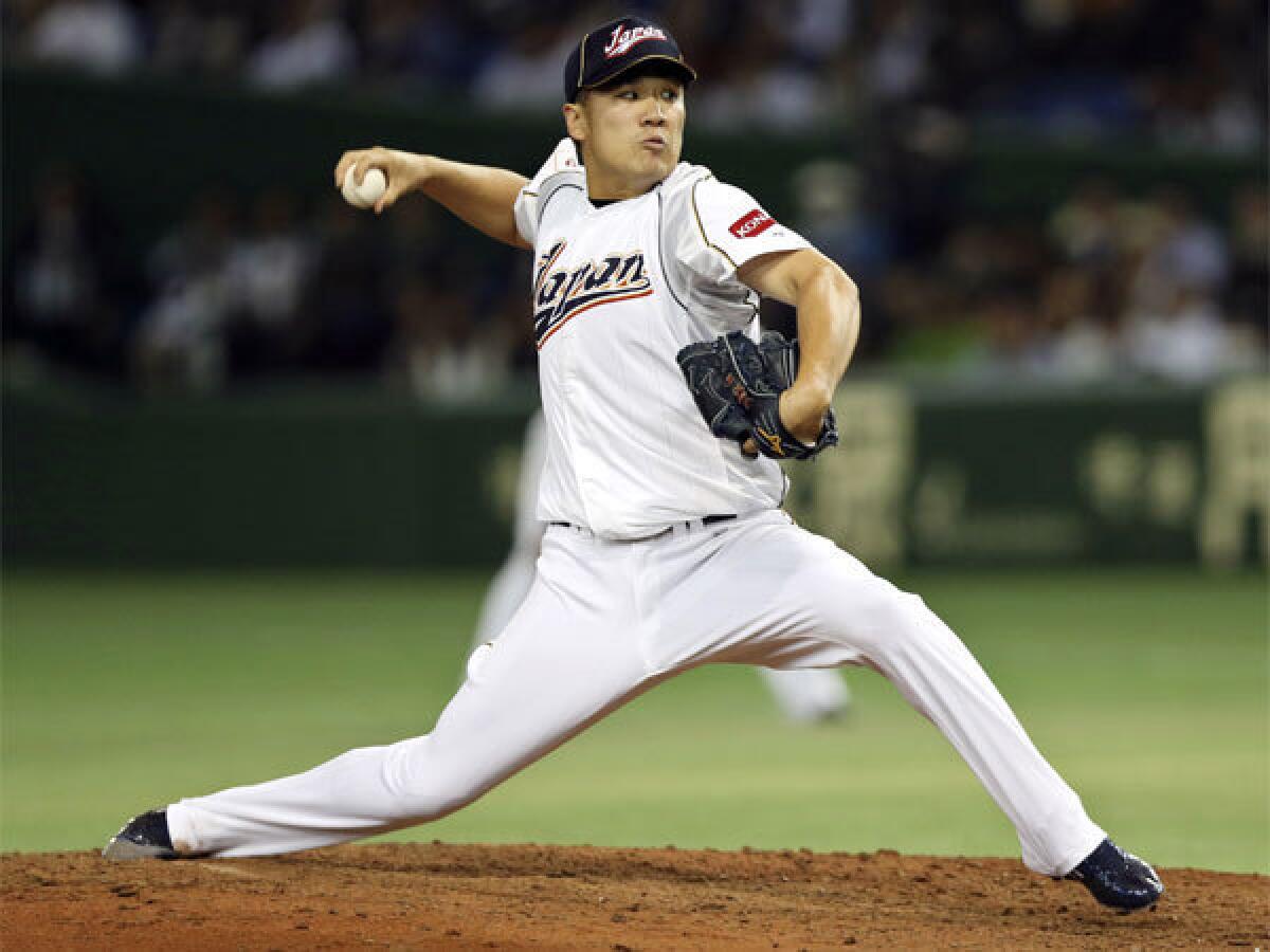 Japan's Masahiro Tanaka pitches against the Netherlands in the World Baseball Classic last March in Tokyo.