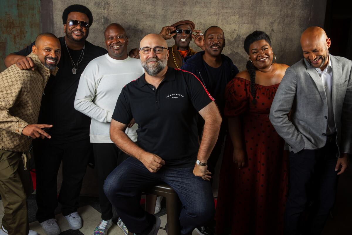 "Dolemite Is My Name" cast members Mike Epps, left, Craig Robinson, Tituss Burgess, Wesley Snipes, Eddie Murphy, Da'Vine Joy Randolph and Keegan-Michael Key with director Craig Brewer, center, at the Toronto International Film Festival.