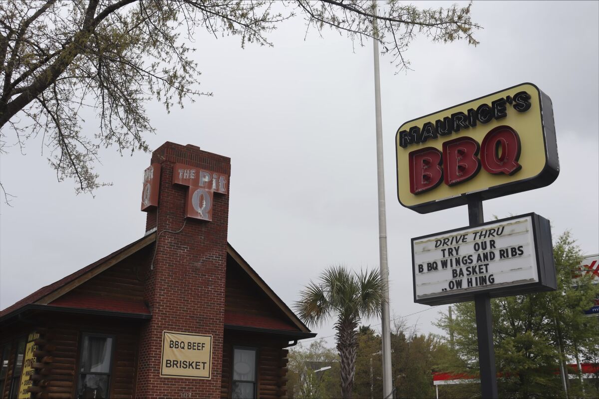 The exterior of Maurice's Piggie Park BBQ at 107 Clemson Rd., is shown, Wednesday, March 22, 2023, in Columbia, S.C. The South Carolina barbecue chain known for its pro-segregation stance in a landmark 1960s case and its embrace of the Confederate flag in 2000 is facing allegations of racism and at one of its restaurants. The general manager of Clemson road Maurice's Piggie Park BBQ location threatened to break the jaw of a Black employee whom he called racial slurs during an expletive-laden voicemail, according to a lawsuit filed last month. (AP Photo/James Pollard)