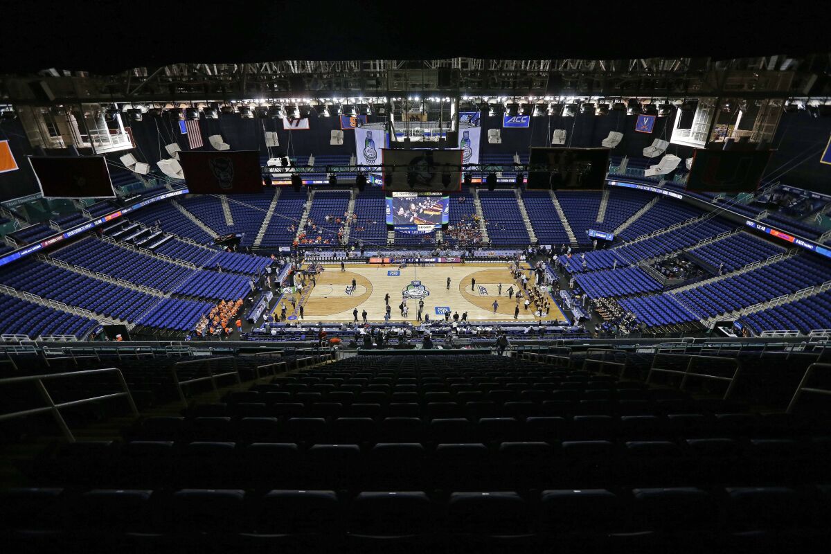 Greensboro Coliseum is mostly empty after the NCAA college basketball games were cancelled at the Atlantic Coast Conference tournament on March 12.