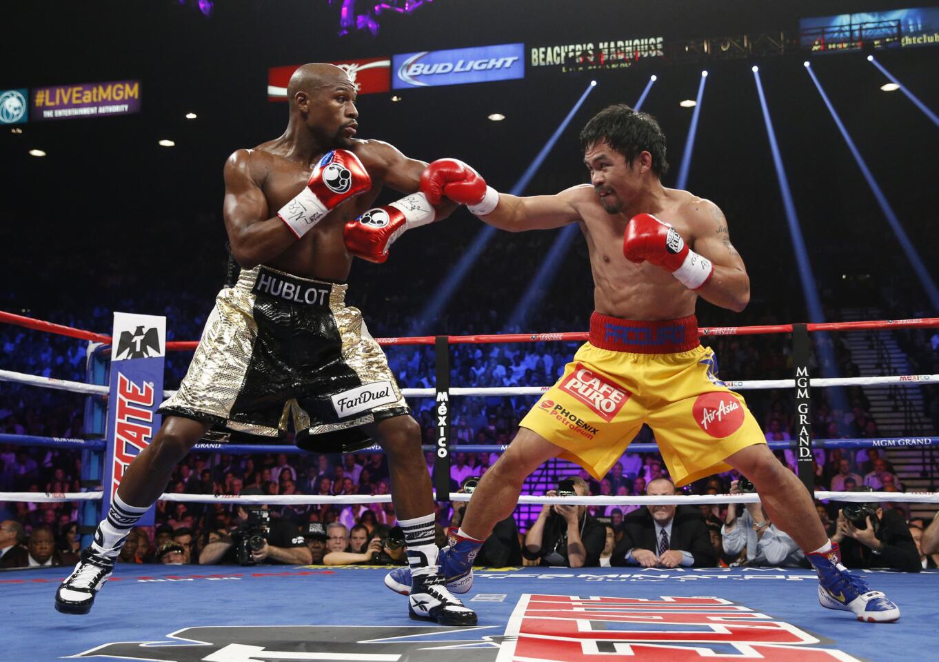 Floyd Mayweather Jr. and Manny Pacquiao trade blows.
