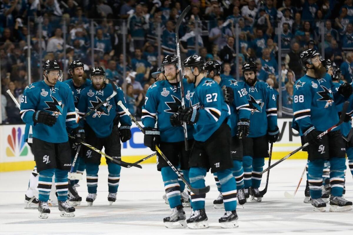 Joonas Donskoi (27) of the San Jose Sharks celebrates with his teammates after scoring the game-winning goal against the Penguins in overtime of Game 3 of the Stanley Cup Final.