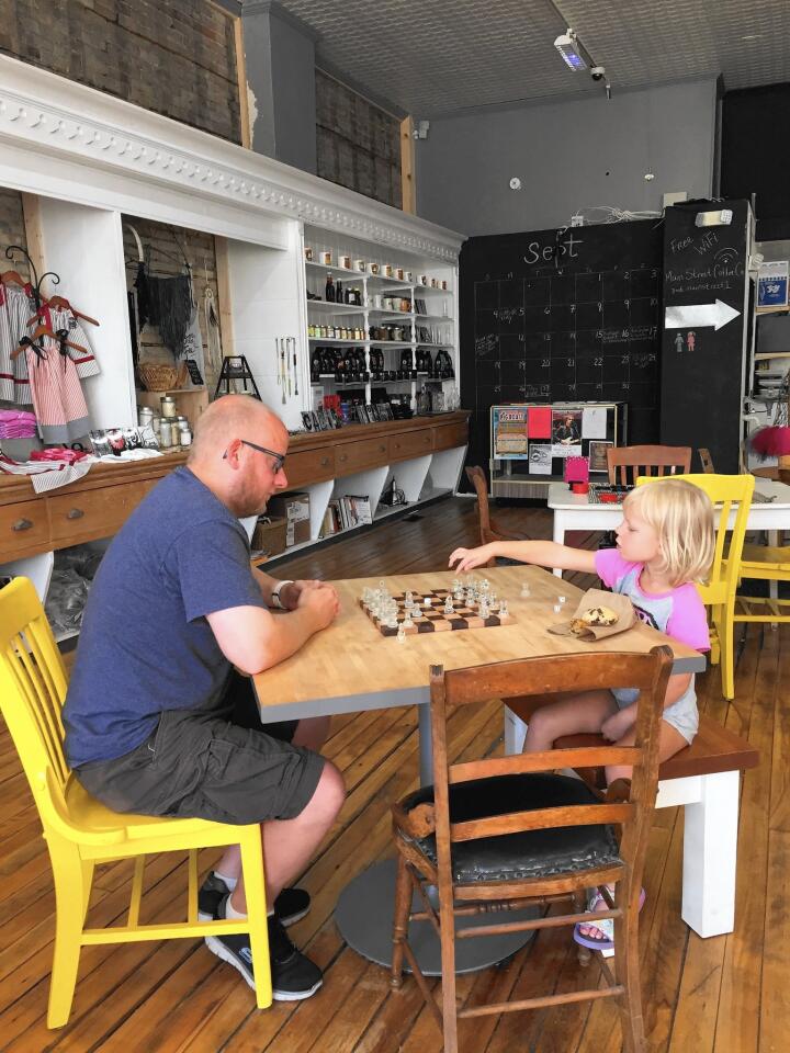Patrons play a game at the inviting Main Street Coffee Co. in downtown Richmond.