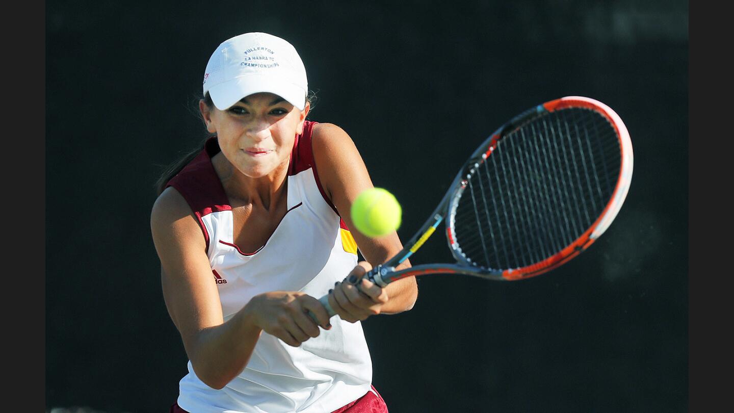 La Canada's Sophie McKenzie hits a backhand shot in a Rio Hondo League tennis match against Temple City on Thursday, October 12, 2017.