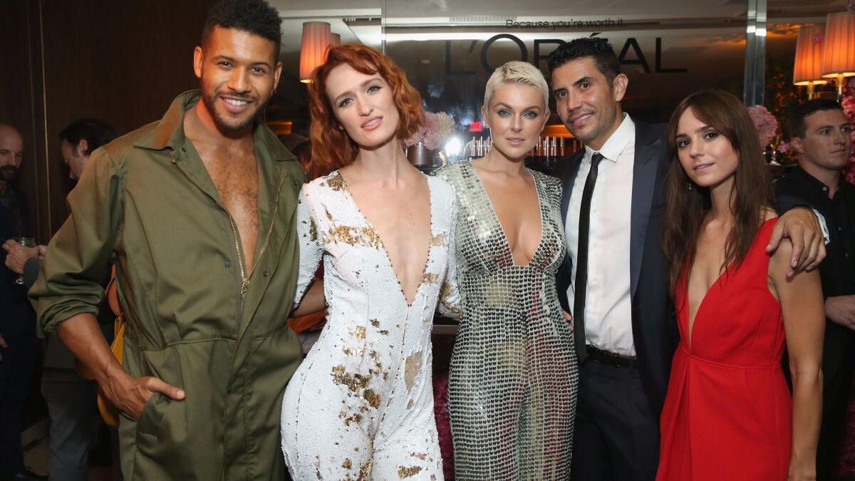 "UnREAL's" Jeffrey Bowyer-Chapman, from left, Breeda Wool of "UnREAL" and "Mr. Mercedes," Serinda Swan of "Inhumans" and "Ballers" and guests at the Entertainment Weekly Pre-Emmy Party at Sunset Tower in West Hollywood on Friday.