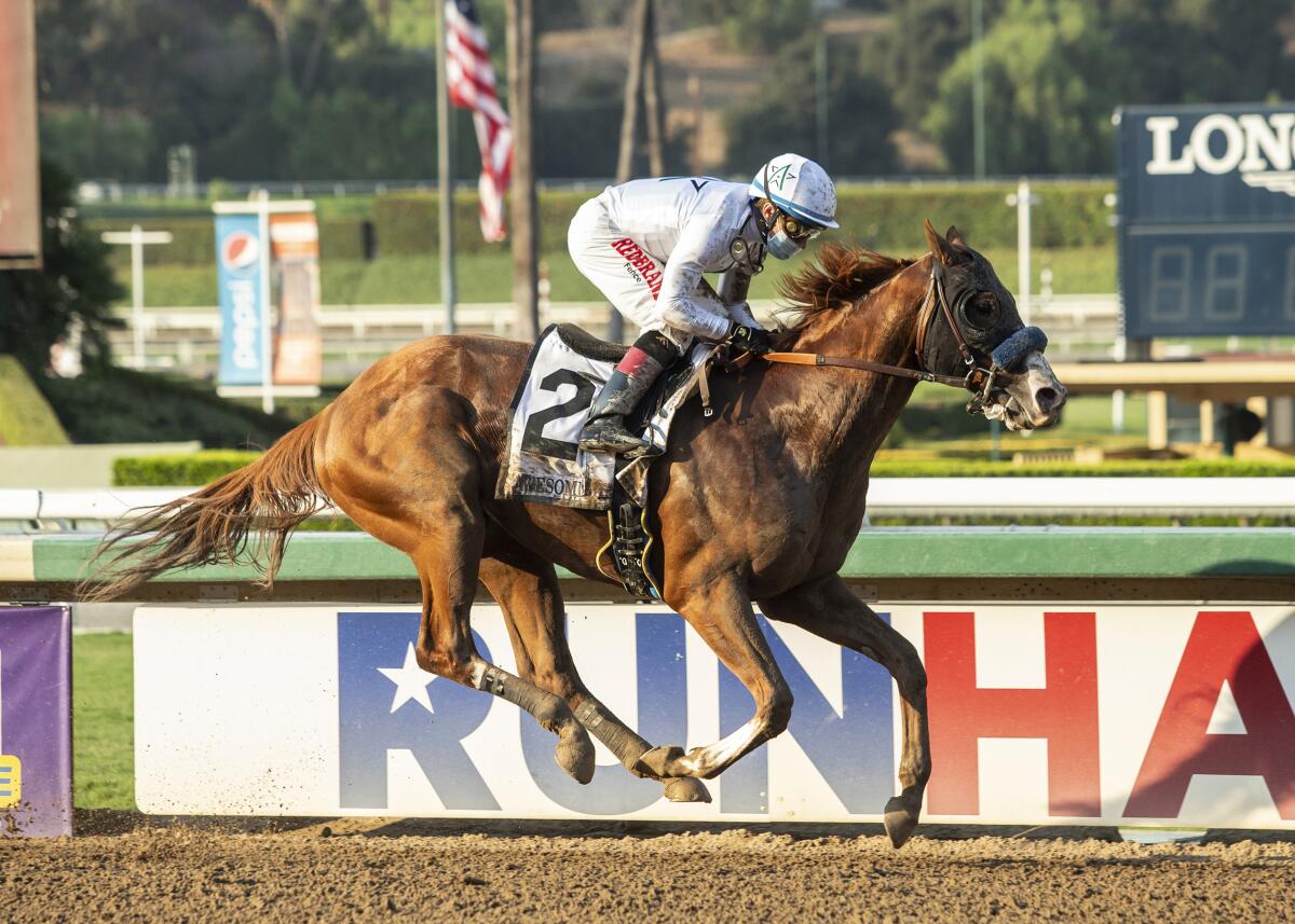 Improbable, with Drayden Van Dyke aboard, wins the Grade 1 Awesome Again Stakes at Santa Anita on Sept. 26, 2020.
