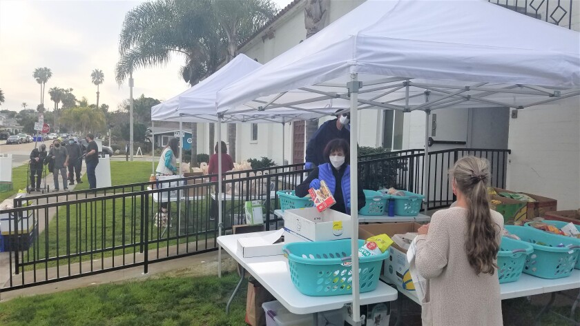 Food is distributed at Ocean Beach pantry Loaves & Fishes.