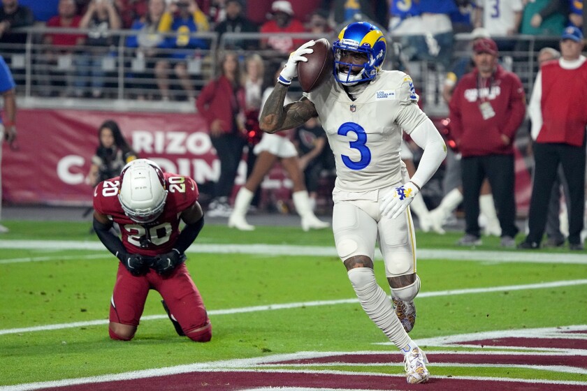 Los Angeles Rams wide receiver Odell Beckham Jr. (3) celebrates his touchdown catch against Arizona Cardinals cornerback Marco Wilson (20) during the first half of an NFL football game Monday, Dec. 13, 2021, in Glendale, Ariz. (AP Photo/Rick Scuteri)