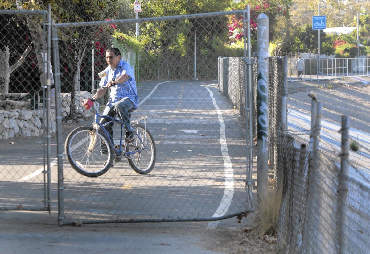 A rider reaches a bike path's end at Egret Park in Los Angeles. A review of a proposed extension would look at costs, designs and concerns.