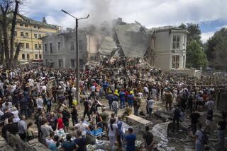 Rescuers and volunteers clean up the rubble and search victims after Russian missile hit the country's main children hospital Okhmadit during massive missile attack on many Ukrainian cities in Kyiv, Ukraine, Monday, July 8, 2024. A major Russian missile attack across Ukraine killed at least 20 people and injured more than 50 on Monday, officials said, with one missile striking a large children’s hospital in the capital, Kyiv, where emergency crews searched rubble for casualties. (AP Photo/Efrem Lukatsky)