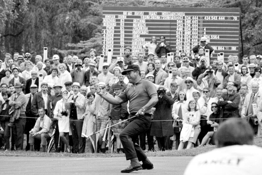 Lee Trevino reacts as his putt on the 11th hole drops for a birdie in final round of the 1968 U.S. Open.