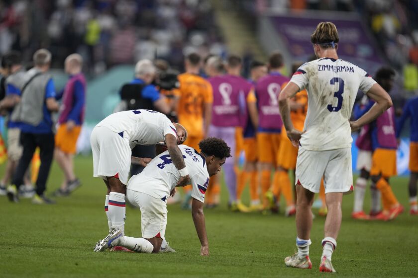 U.S. players react after losing to the Netherlands at the World Cup 