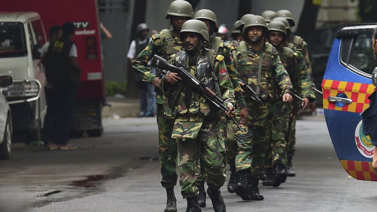 Bangladeshi army soldiers patrol a street during a rescue operation in the Dhakas high-security diplomatic district on July 2.