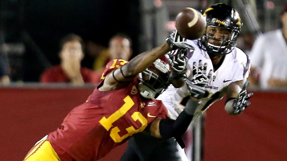 USC defensive back Kevon Seymour breaks up a pass intended for Arizona State wide receiver Gary Chambers during a game on Oct. 4, 2014.