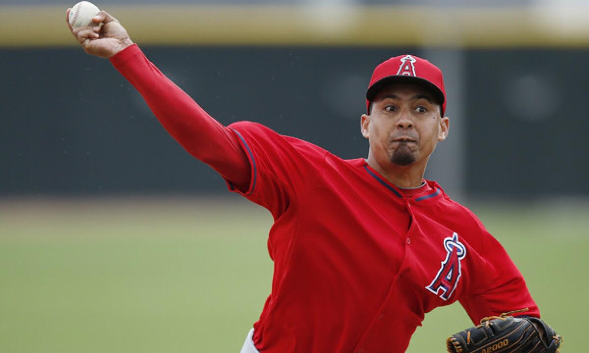 Angels closer Ernesto Frieri delivers a pitch during a spring-training practice session Feb. 25. Frieri make a brief spring-training debut for the Angels in a 3-2 exhibition win over the Arizona Diamondbacks on Monday.