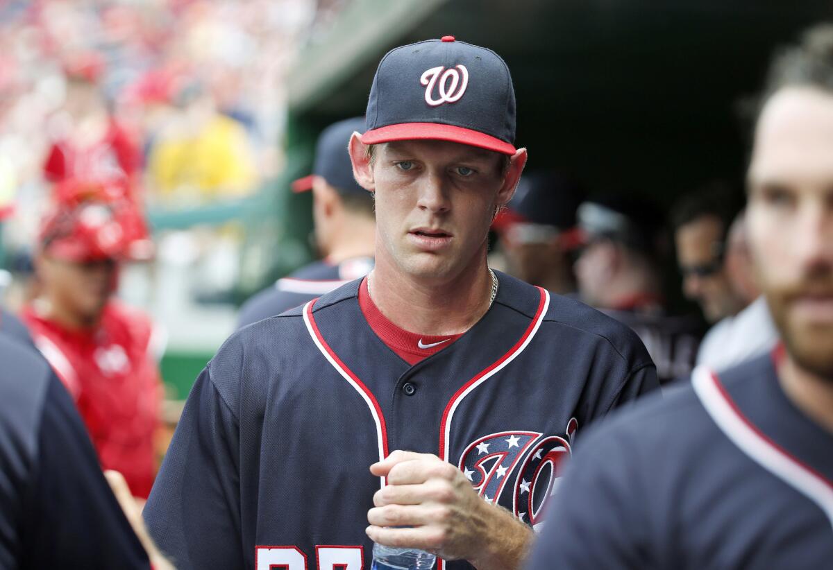 Nationals pitcher Stephen Strasburg enters the dugout before a game against the St. Louis Cardinals on May 29.