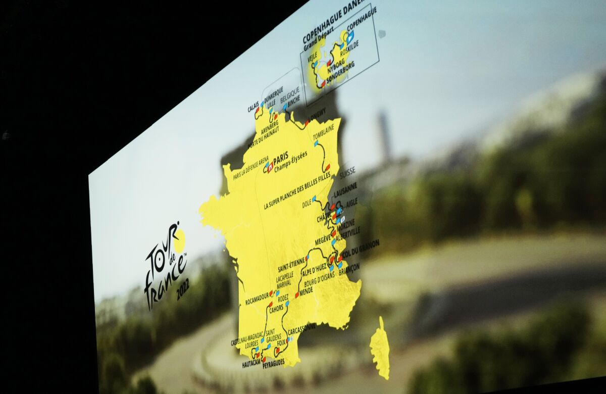 The roadmap of the Tour de France 2022 cycling race is projected on a screen during the presentation of the Tour de France 2022 cycling race, in Paris, Thursday Oct. 14, 2021. The 109th edition of the race starts on July 1 2022 to end on the Champs-Elysees avenue on July 24 2022. (AP Photo/Thibault Camus)