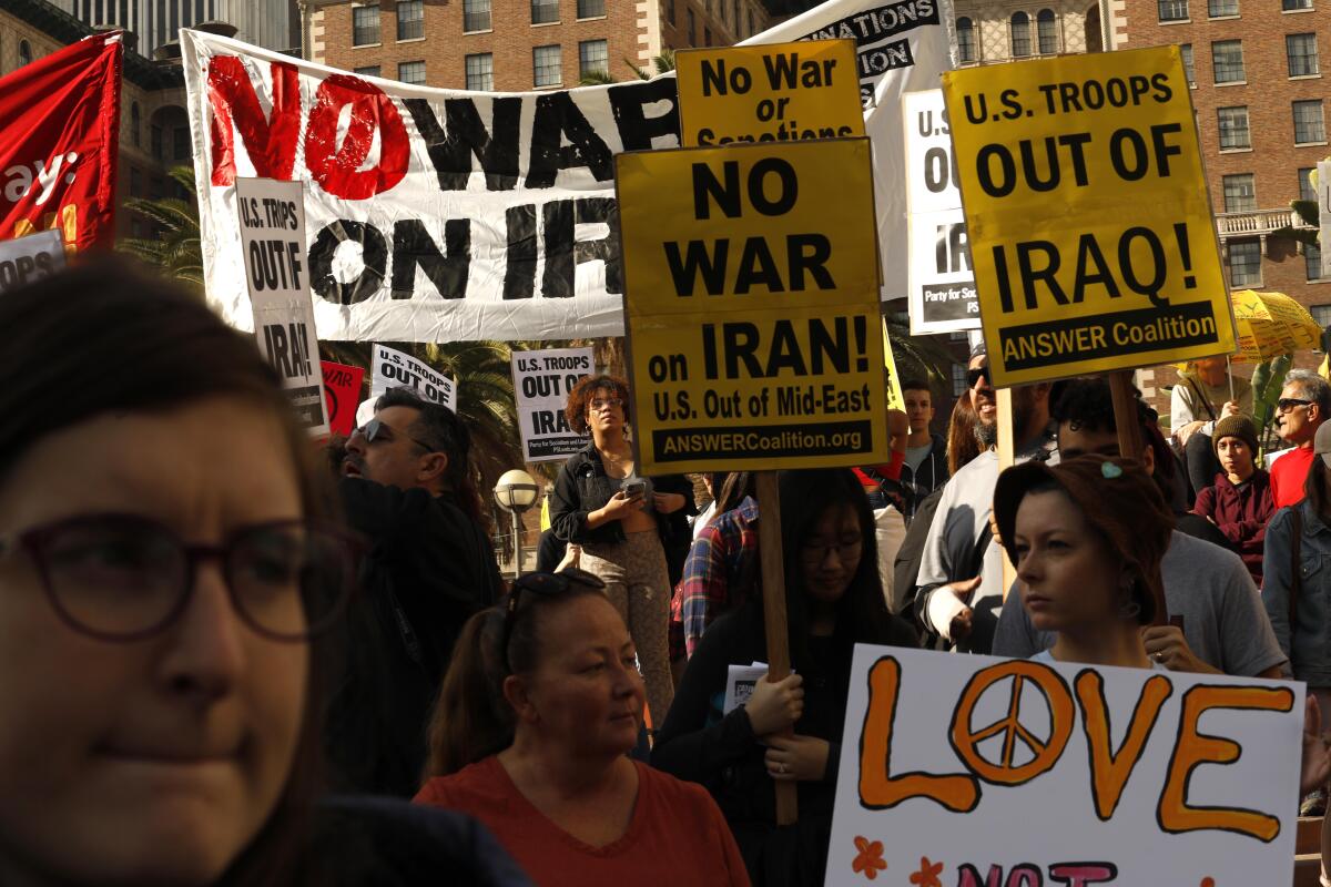 Around 300 people take part in a National Day of Protest in Pershing Square on Jan. 4, voicing their opposition to war with Iran days after a top Iranian military commander was killed in a U.S. airstrike in Baghdad.