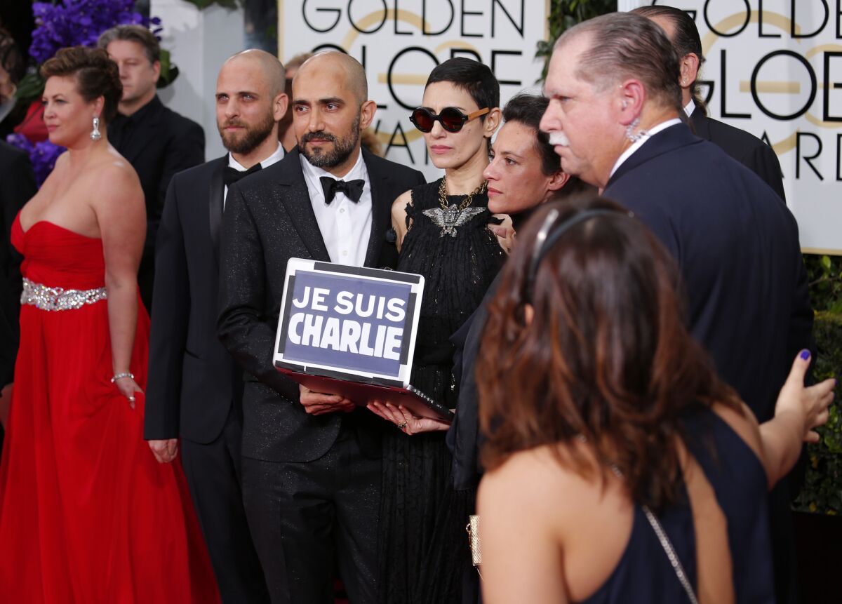 Filmmakers show their support for recent events at the 72nd Golden Globe Awards show at the Beverly Hilton Hotel.