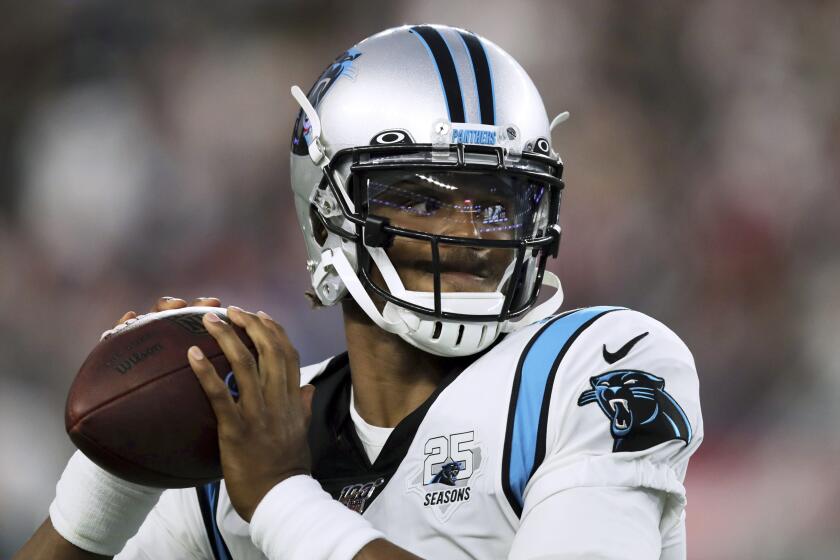 Carolina Panthers quarterback Cam Newton warms up before an NFL preseason football game.