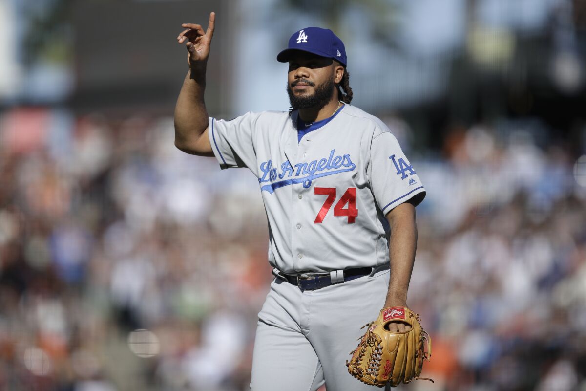 Dodgers pitcher Kenley Jansen celebrates the 2-0 win over the San Francisco Giants on Saturday in San Francisco.